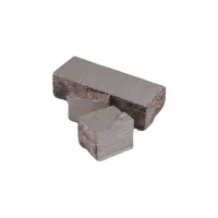 A rough, silvery bismuth crystal with geometric shapes.